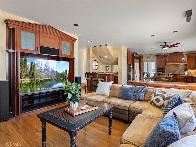 living room with recessed lighting and light wood finished floors