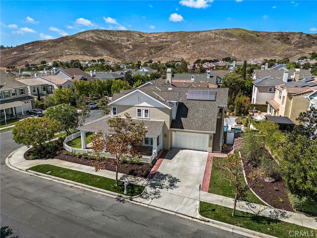 aerial view with a mountain view and a residential view