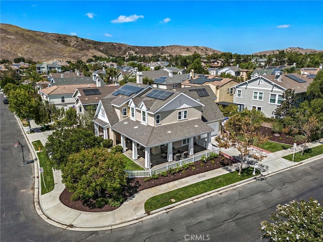 aerial view with a mountain view and a residential view