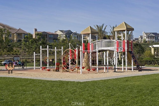 community play area featuring a lawn