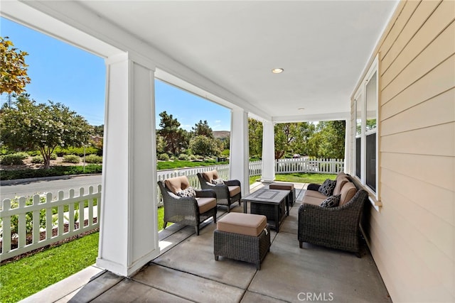 view of patio / terrace with an outdoor living space and fence