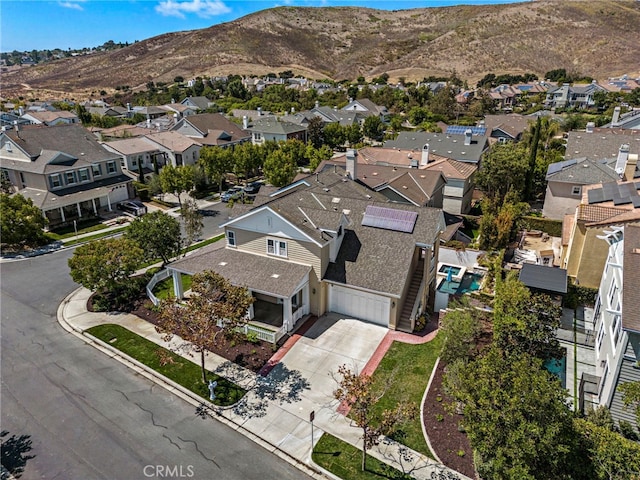 birds eye view of property with a residential view and a mountain view