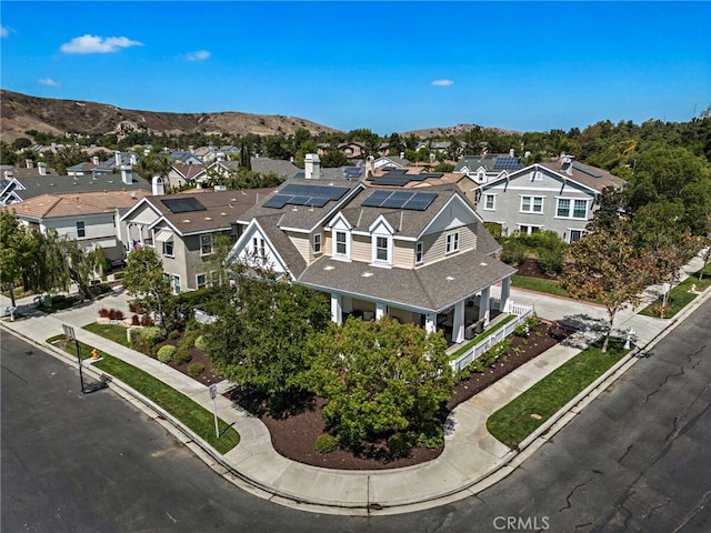 aerial view featuring a mountain view and a residential view