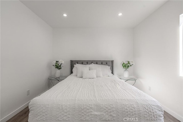 bedroom featuring recessed lighting, baseboards, and wood finished floors