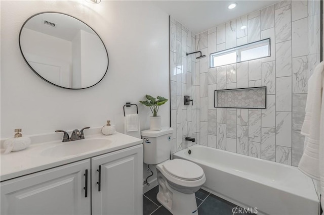 full bathroom featuring tile patterned floors, visible vents, toilet, shower / bathing tub combination, and vanity