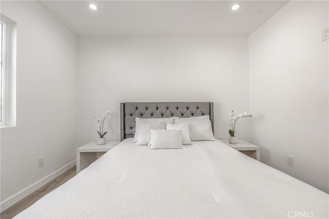 bedroom featuring recessed lighting, baseboards, and wood finished floors