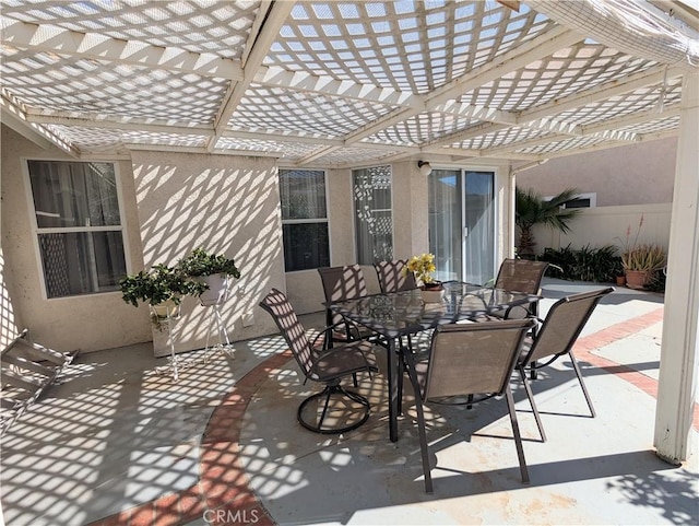 view of patio / terrace with outdoor dining space and a pergola