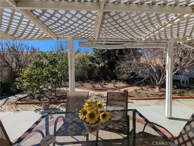 view of patio / terrace featuring fence and a pergola