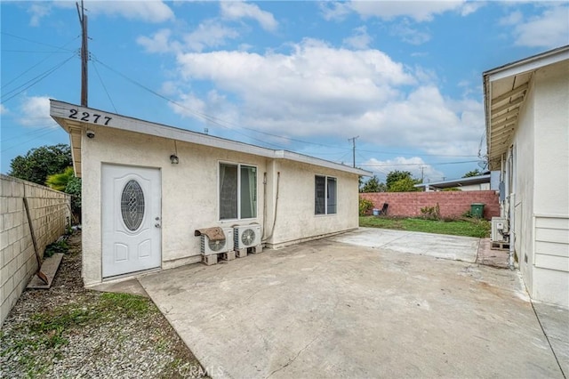 back of property featuring a patio area, a fenced backyard, and stucco siding