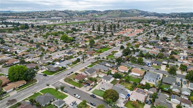 drone / aerial view with a mountain view and a residential view