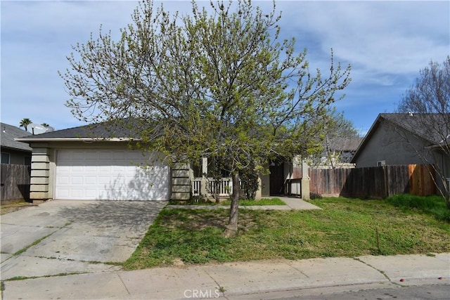 view of front of house with driveway, an attached garage, and fence