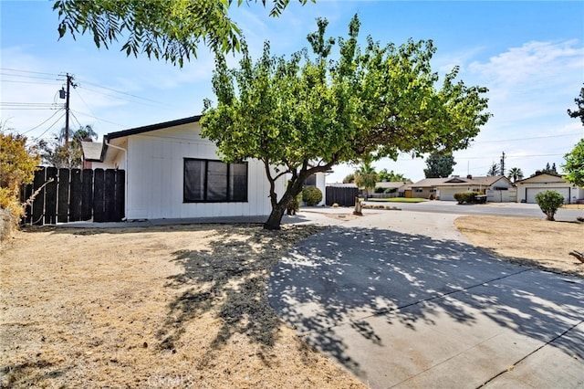 view of front of home featuring fence