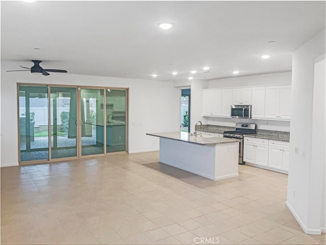 kitchen with recessed lighting, stainless steel appliances, plenty of natural light, and white cabinetry