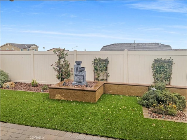 view of yard featuring a fenced backyard