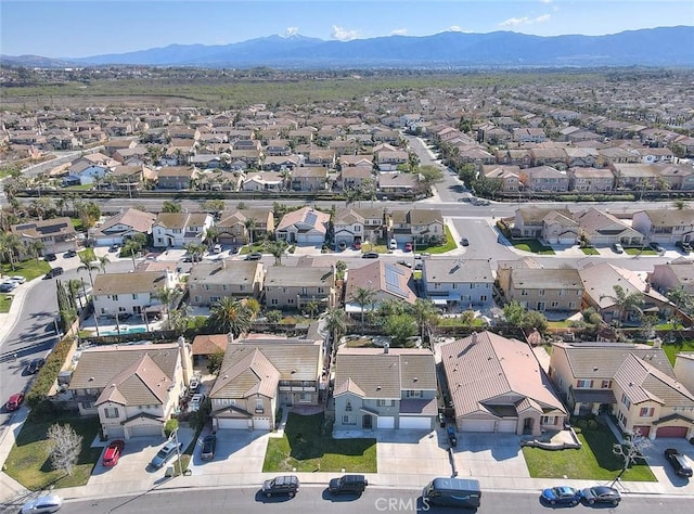 aerial view featuring a mountain view and a residential view