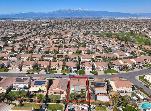 drone / aerial view featuring a mountain view and a residential view