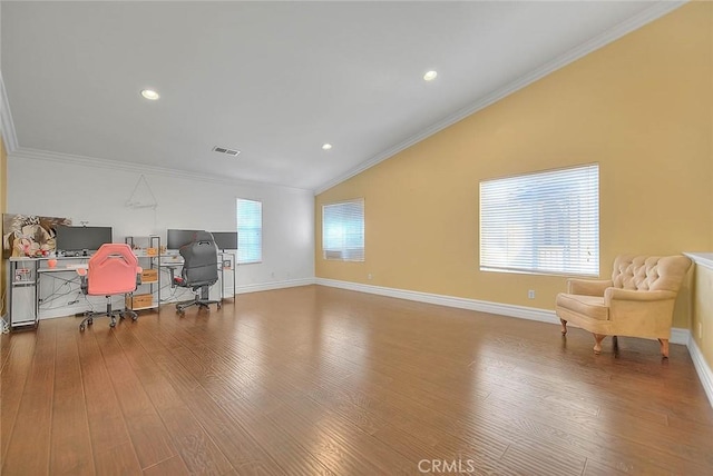 office area featuring vaulted ceiling, crown molding, wood finished floors, and baseboards