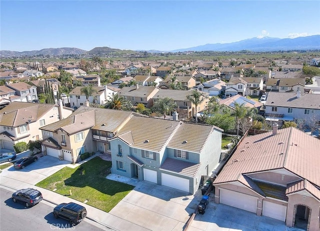 aerial view featuring a mountain view and a residential view