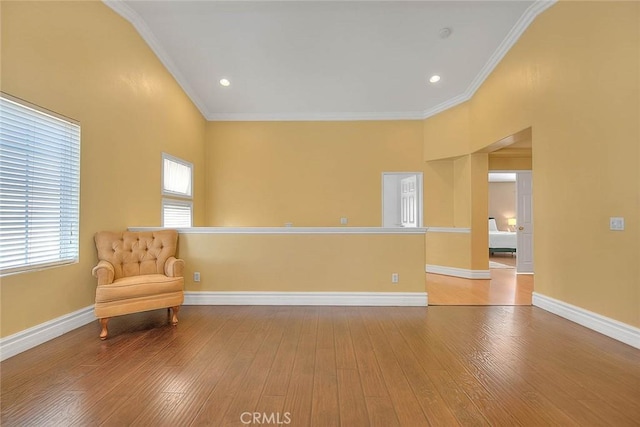 unfurnished room with recessed lighting, crown molding, baseboards, and wood finished floors