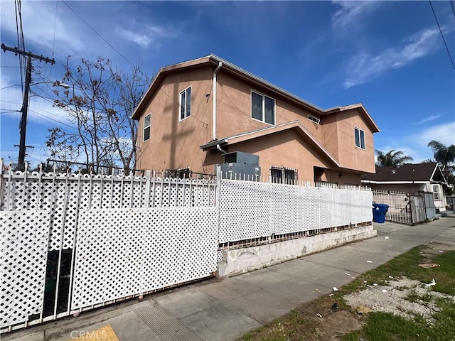 9145 Orchard Ave, Los Angeles, CA 90044 - view of side of property featuring stucco siding
