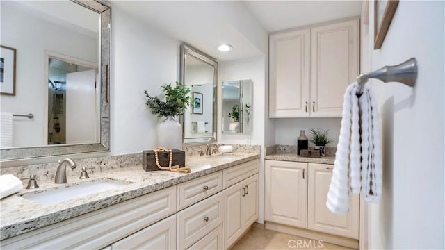 bathroom featuring double vanity and a sink