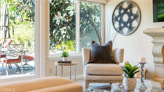 sitting room with tile patterned flooring and a healthy amount of sunlight