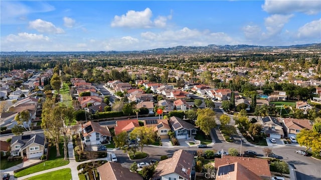 birds eye view of property with a residential view