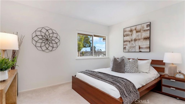 bedroom with light carpet