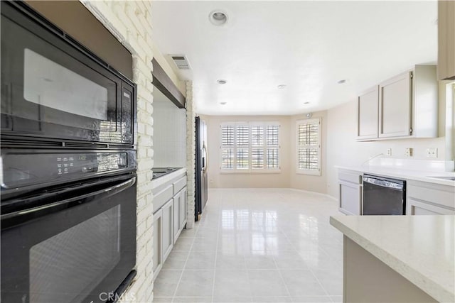 kitchen featuring visible vents, black appliances, recessed lighting, light tile patterned floors, and baseboards