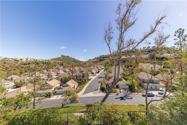 birds eye view of property featuring a mountain view and a residential view