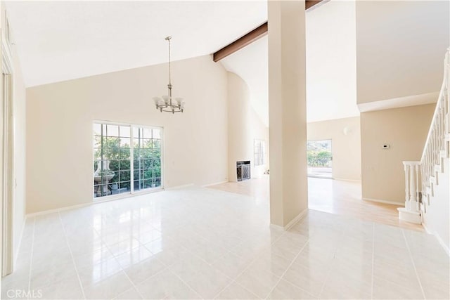 spare room featuring beamed ceiling, high vaulted ceiling, an inviting chandelier, light tile patterned flooring, and stairs