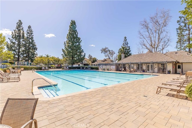 community pool with a patio