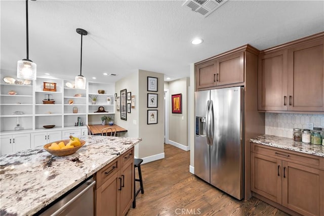 33121 Ocean Rdg, Dana Point, CA 92629 - kitchen with stainless steel appliances, open shelves, backsplash, dark wood-style floors, and light stone counters