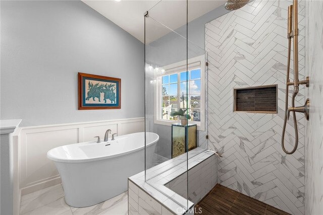 33121 Ocean Rdg, Dana Point, CA 92629 - full bath with a tile shower, a soaking tub, a wainscoted wall, marble finish flooring, and a decorative wall