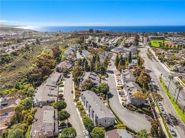 birds eye view of property featuring a water view and a residential view