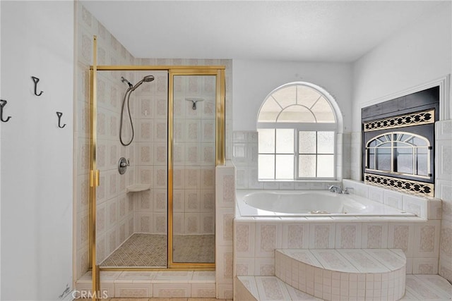 bathroom with a bath and a shower stall