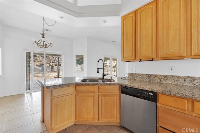 kitchen with a sink, a peninsula, plenty of natural light, and dishwasher
