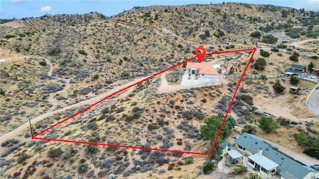 bird's eye view with a rural view, a mountain view, and a desert view