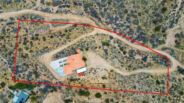 birds eye view of property with a desert view
