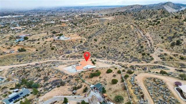 birds eye view of property with a rural view, a mountain view, and a desert view