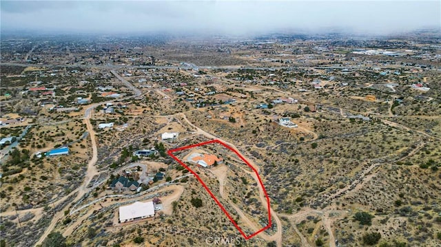 aerial view with view of desert and a rural view