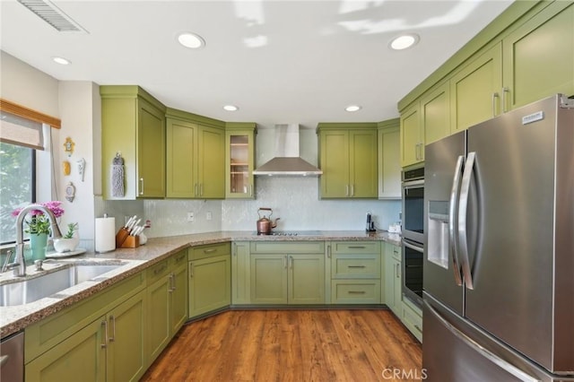 22176 Dogie Pl, Canyon Lake, CA 92587 - kitchen with appliances with stainless steel finishes, green cabinetry, wall chimney exhaust hood, and recessed lighting