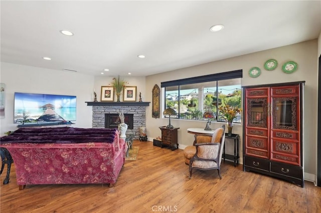 22176 Dogie Pl, Canyon Lake, CA 92587 - living room with a stone fireplace, wood finished floors, and recessed lighting