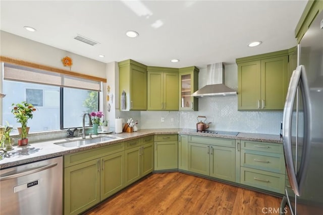 22176 Dogie Pl, Canyon Lake, CA 92587 - kitchen featuring green cabinetry, appliances with stainless steel finishes, wall chimney range hood, dark wood-type flooring, and light stone counters