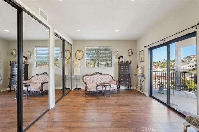22176 Dogie Pl, Canyon Lake, CA 92587 - living area with plenty of natural light, wood finished floors, and recessed lighting
