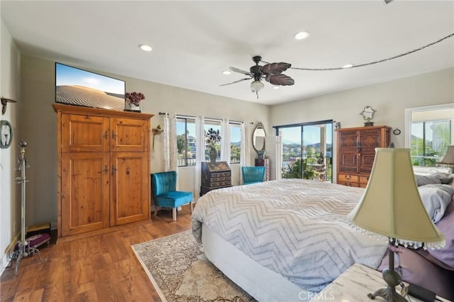 22176 Dogie Pl, Canyon Lake, CA 92587 - bedroom featuring access to exterior, recessed lighting, wood finished floors, and ceiling fan