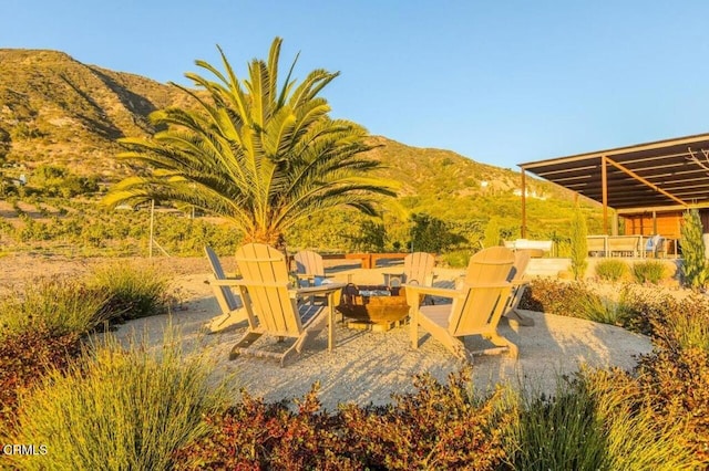 view of patio / terrace featuring a mountain view