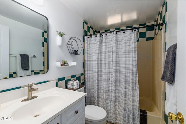 bathroom featuring shower / bath combo with shower curtain, toilet, and vanity