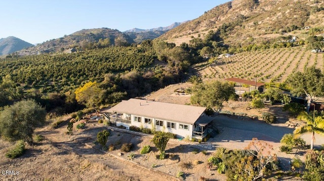 birds eye view of property with a mountain view