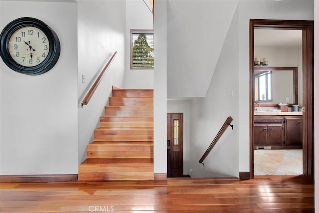 stairway featuring hardwood / wood-style floors